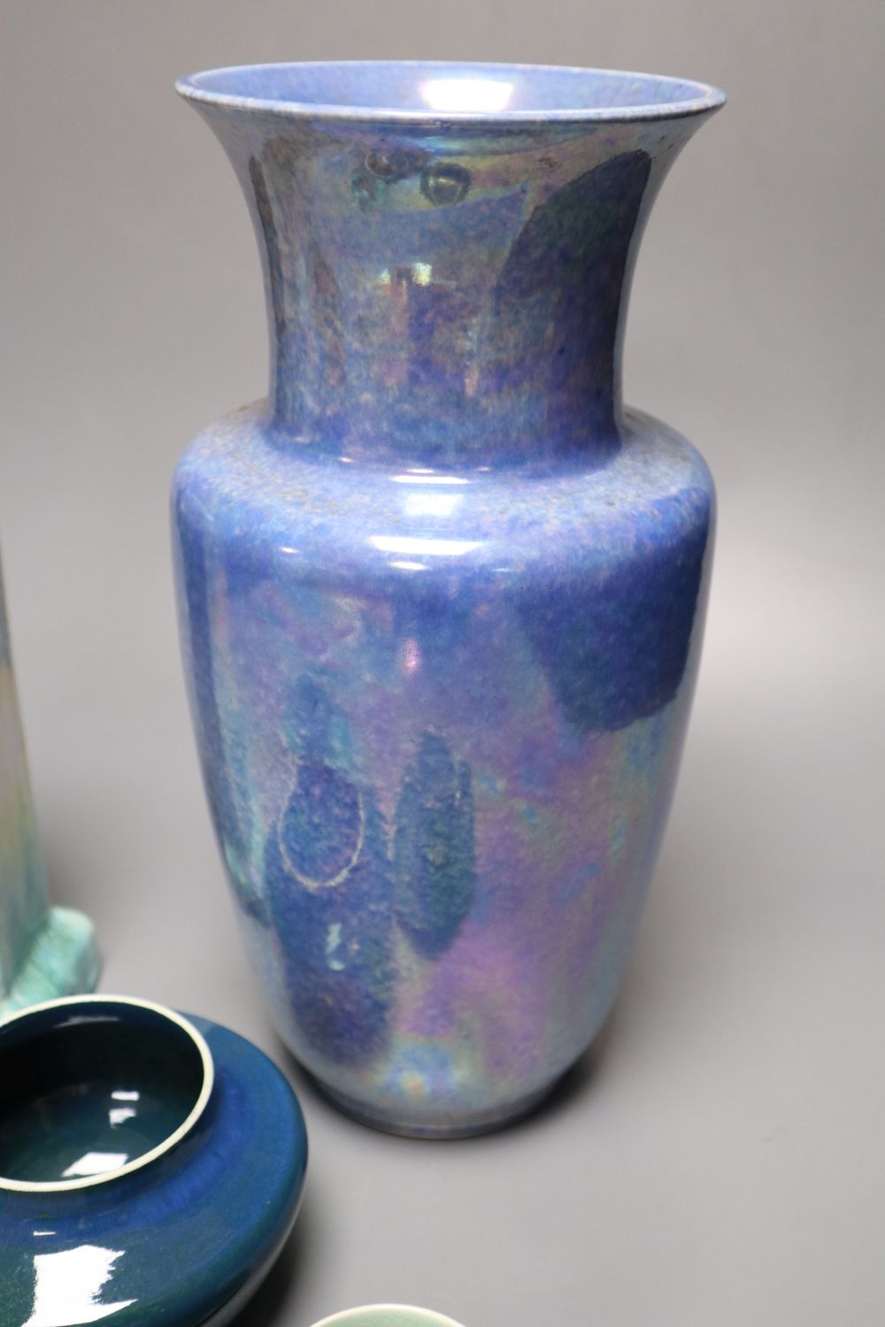 A collection of Ruskin pottery, including a blue lustre vase,